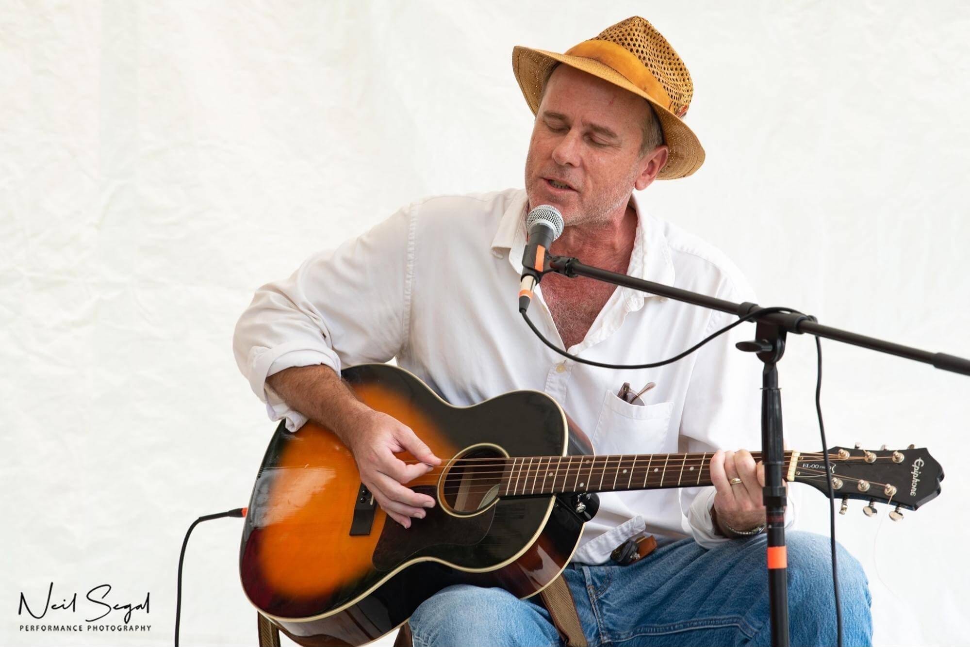 Neil Howard performs at the Woodstock 50-50 Festival on the back lawn of the Colony in Woodstock