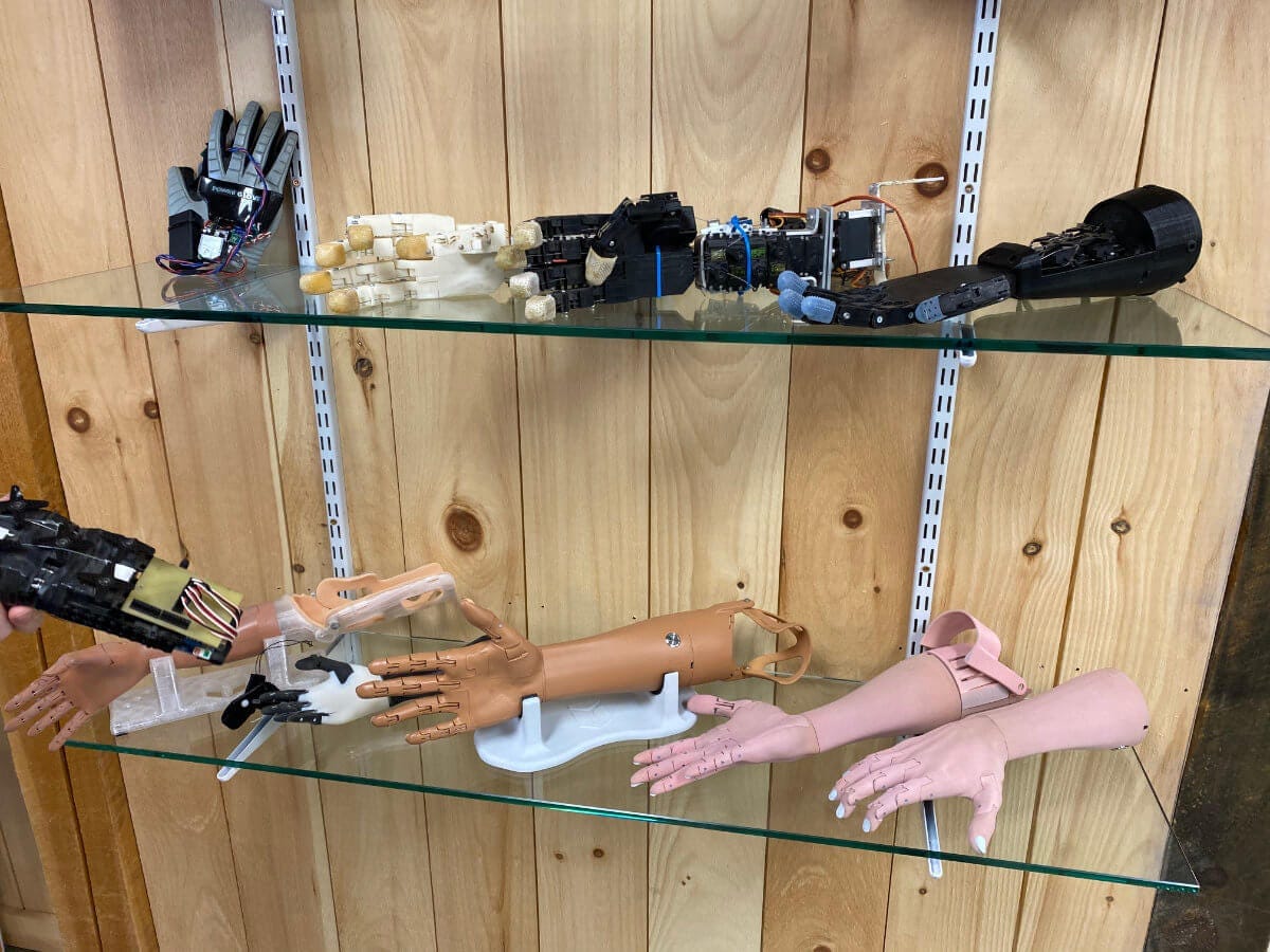 Different generations of prosthetic arms at Unlimited Tomorrow headquarters in Rhinebeck