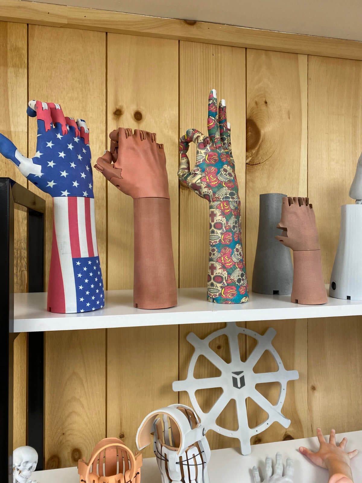 Prosthetic arms with various styles at Unlimited Tomorrow headquarters in Rhinebeck