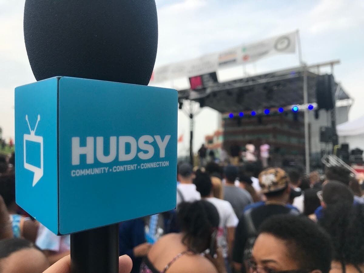 A microphone with the HUDSY branding