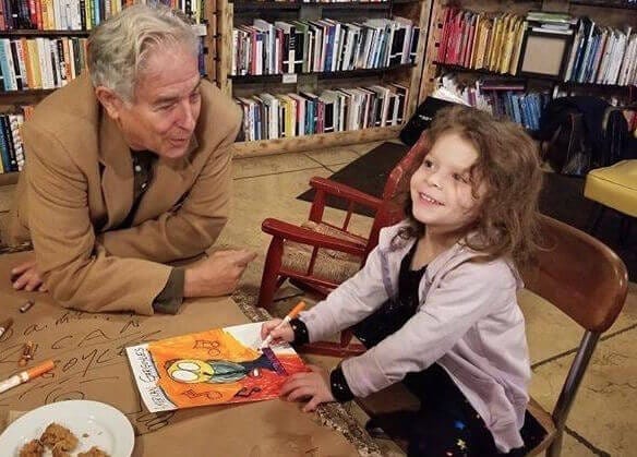 Neil Cohen with a young fan at Rough Draft in Kingston